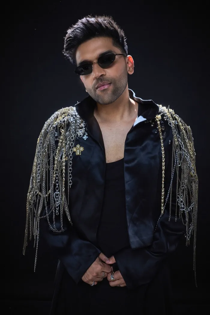 Guru Randhawa in sunglasses and a black fringe jacket